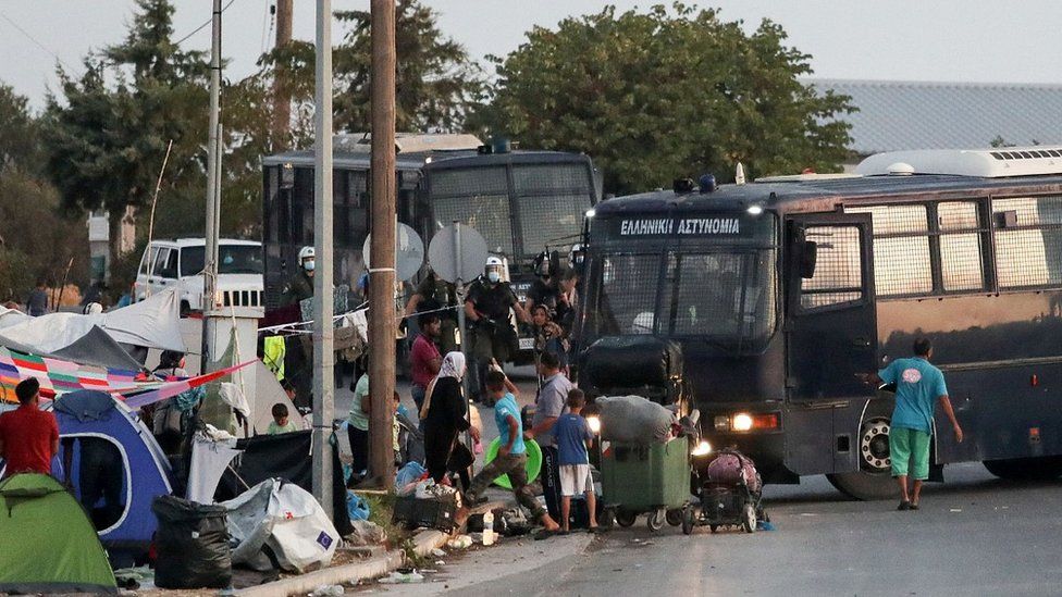 Police bus and migrants on Lesbos, 17 Sep 20