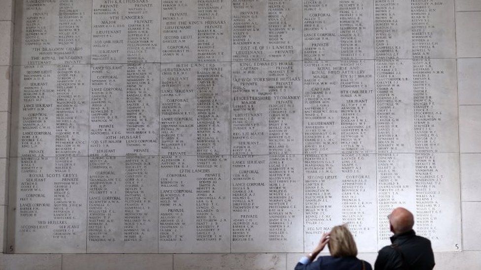 People look at the names of some of fallen soldiers on the Menin Gate in Ypres