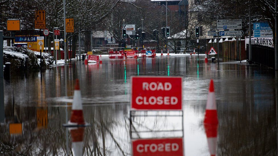 Flood water remains around Tybridge Street in Worcester after overnight snow showers. Picture date: Sunday January 24, 2021.