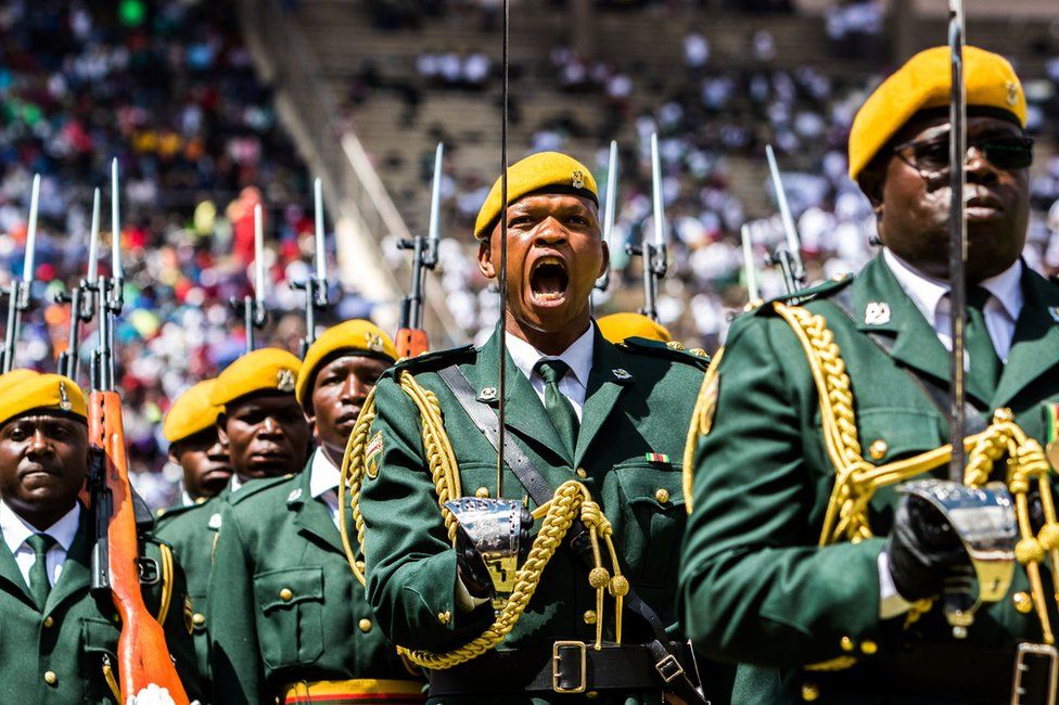Members of Zimbabwe's guard of honour parade during the country's 37th Independence Day celebrations Tuesday. / AFP PHOTO / 18 April 2017