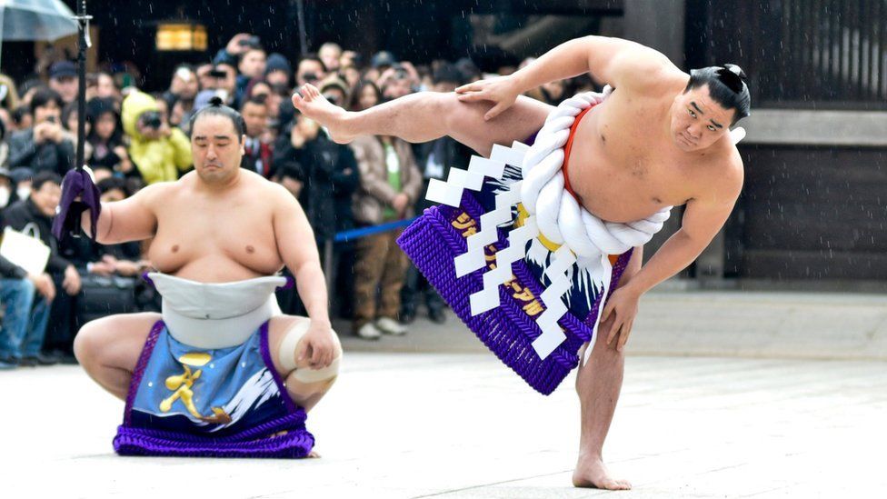 Sumo Grand Champion Harumafuji Kohei (R)performs "Dohyo-iri" (ring purification ritual) during Dezuiri ceremony at the Meiji Shrine on January 8, 2014 in Tokyo, Japan