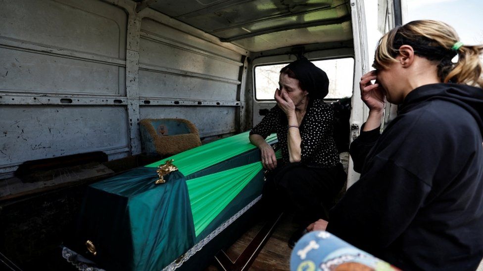 Vira Pylypenko, 65, and her daughter in law Tetiana Pylypenko, 31, mourn son and husband Sergii Pylypenko, 36, a territorial defence member, who according to his family was killed by Russian soldiers along with his friend while driving to Bucha