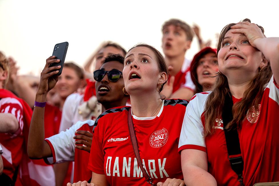 Spectators watch the action in the UEFA Euro 2020 Semi-final match between Denmark and England at the Ophelia Plads Fan Village in Copenhagen, Denmark