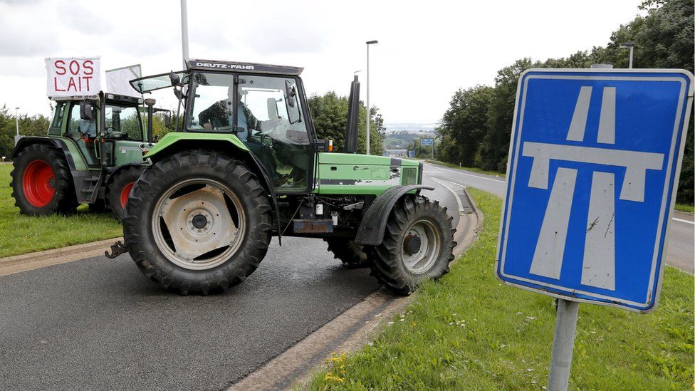 Farmers' tractors block road in Belgium, 30 Jul 15