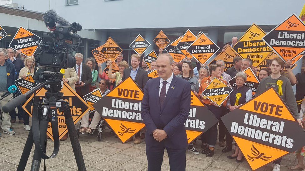Ed Davey in front of crowd and camera