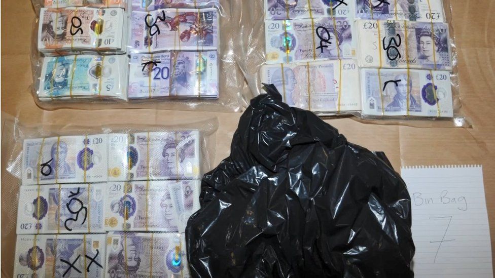 Seized cash taken from a black bin bag