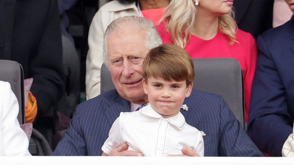 Prince Louis of Cambridge sits on Prince Charles, Prince of Wales lap