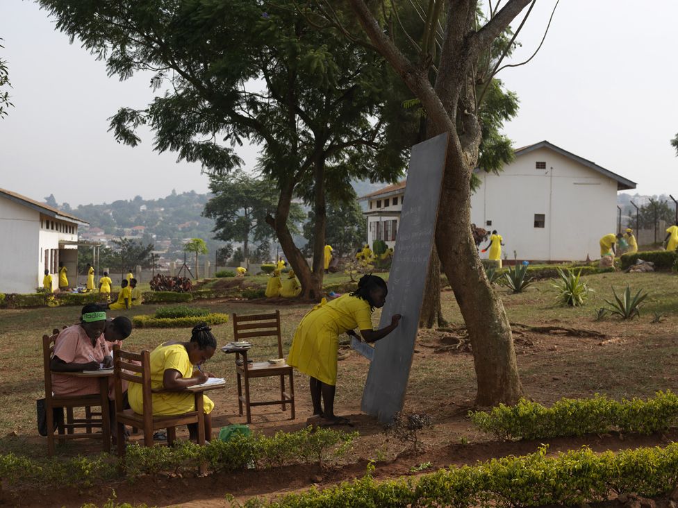 The women in Luzira prison hold classes under trees