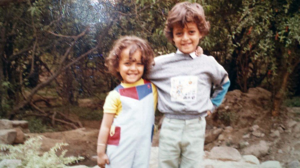 Childhood photo of Mai and her brother in Taiz
