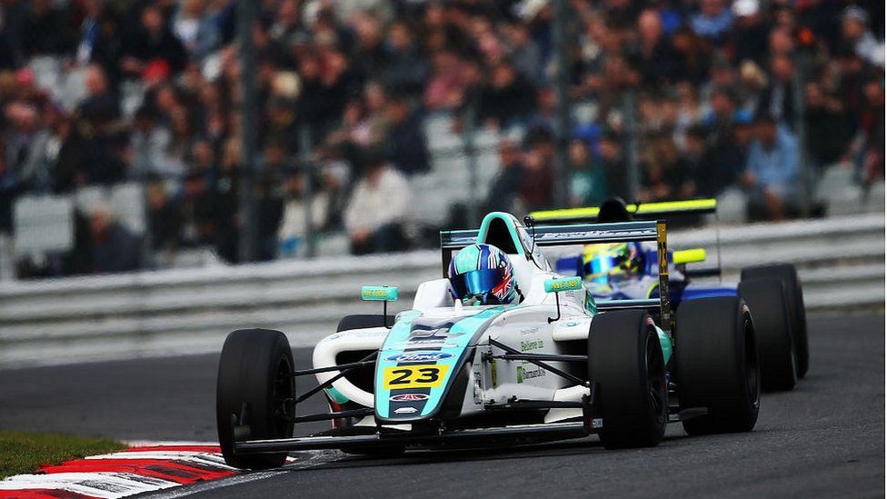 Billy Monger racing Formula 4 car