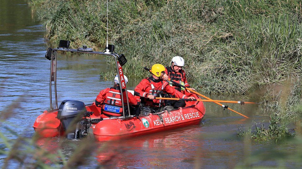 Members of Kent Search and Rescue scour a section of the River Stour