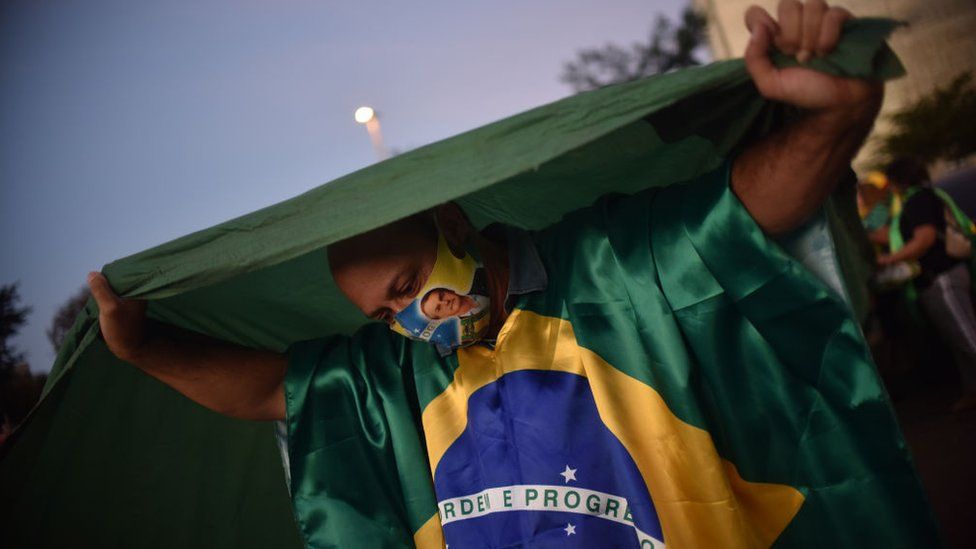 Supporters of Brazil's President Jair Bolsonaro take part in a protest in front of the Superior Electoral Tribunal (TSE), amid the Coronavirus (COVID-19) outbreak, in Brasilia Brazil June 9, 2020