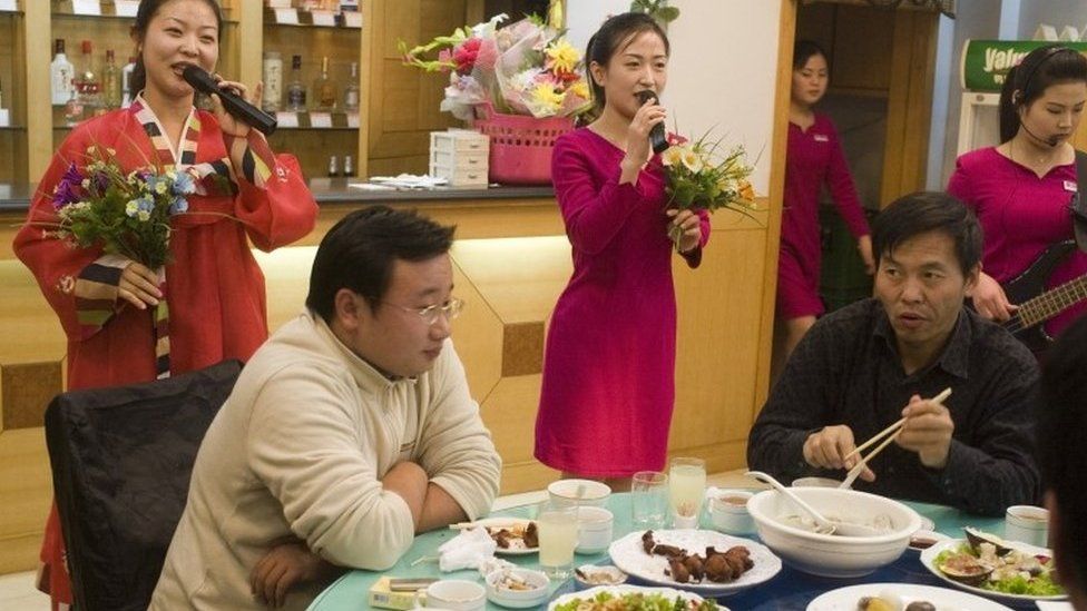 North Korean women perform in a restaurant in Liaoning, China (file image)