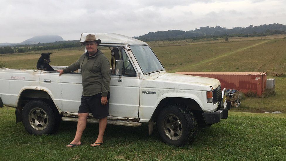 Craig Caulfield standing next to his ute on his old property