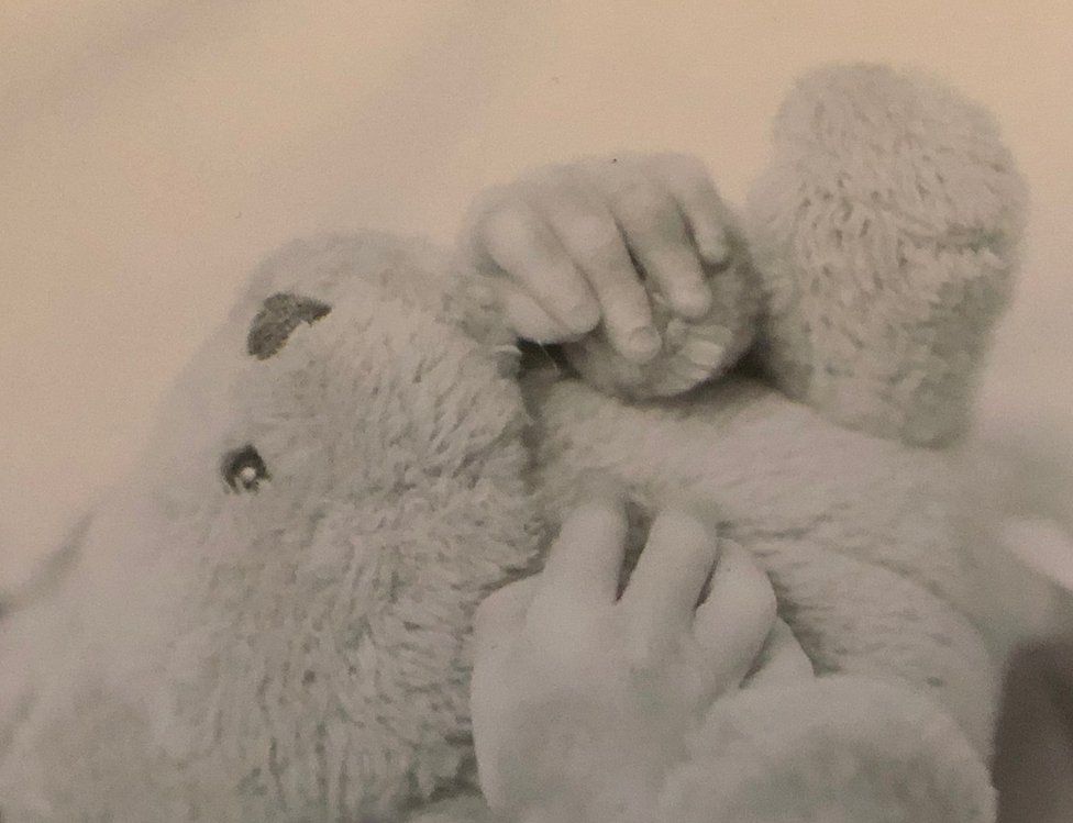 Laura Gallazzi's baby and teddy bear