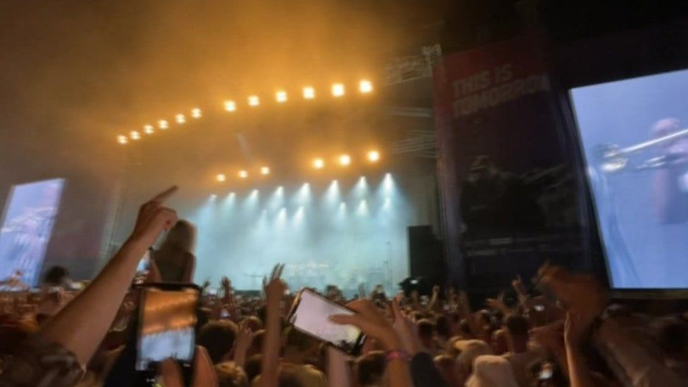 Crowd watching stage at festival