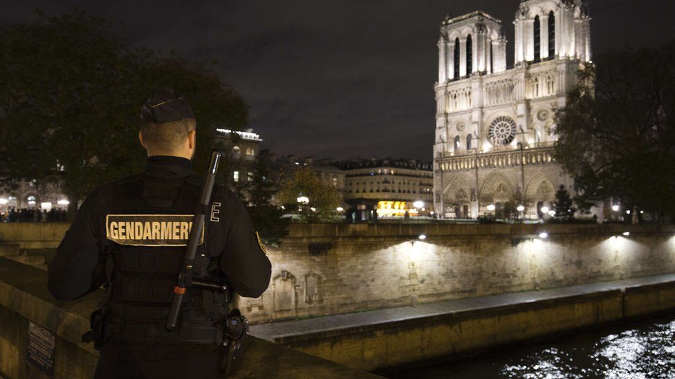 French gendarme near Norte Dame cathedral in Paris on 19 November 2015