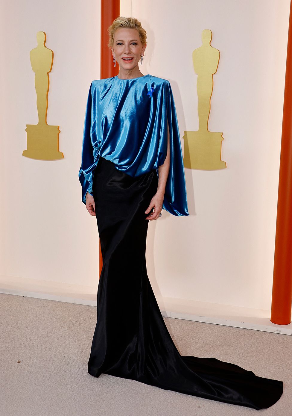 Cate Blanchett poses on the champagne-colored red carpet during the Oscars arrivals at the 95th Academy Awards in Hollywood, Los Angeles, California, U.S., March 12, 2023