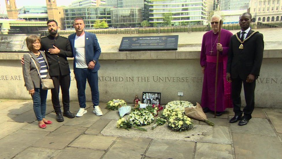 Amir Eden (second left) with others paying homage to the victims
