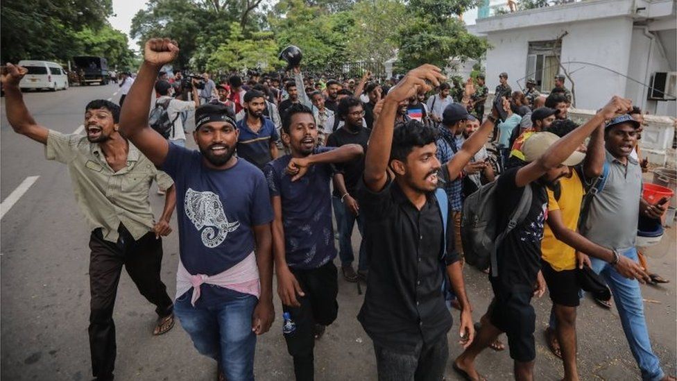 Protesters cheer and shout slogans after they vacate the Prime Minister"s office in Colombo, Sri Lanka, 14 July 2022. after the resignation of Gotabaya Rajapaksa from the presidency