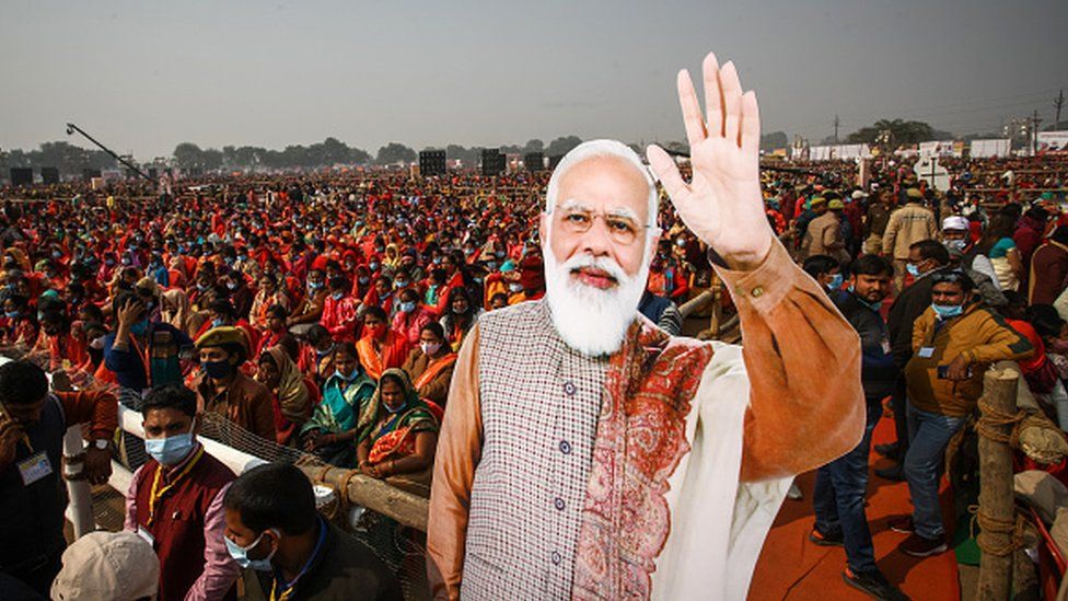 Women from various districts are seen near cut-outs of India's Prime Minister Narendra Modi at a rally held by Modi on December 21, 2021 in Allahabad, India.