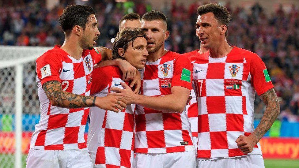 Croatia's Luka Modric celebrates scoring a penalty with his teammate