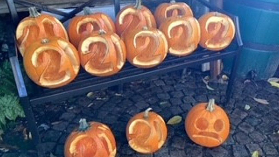 Pumpkins carved with the number 20