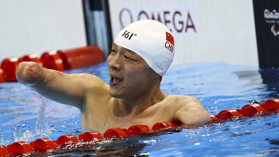 Qing Xu of China reacts in the Olympic pool after the Men's 50m freestyle S6
