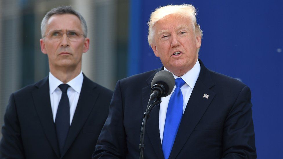 Donald Trump (R) speaks alongside Nato Secretary General Jens Stoltenberg in Brussels, 25 May