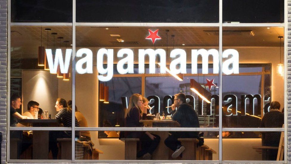 Diners in a Wagamama restaurant.