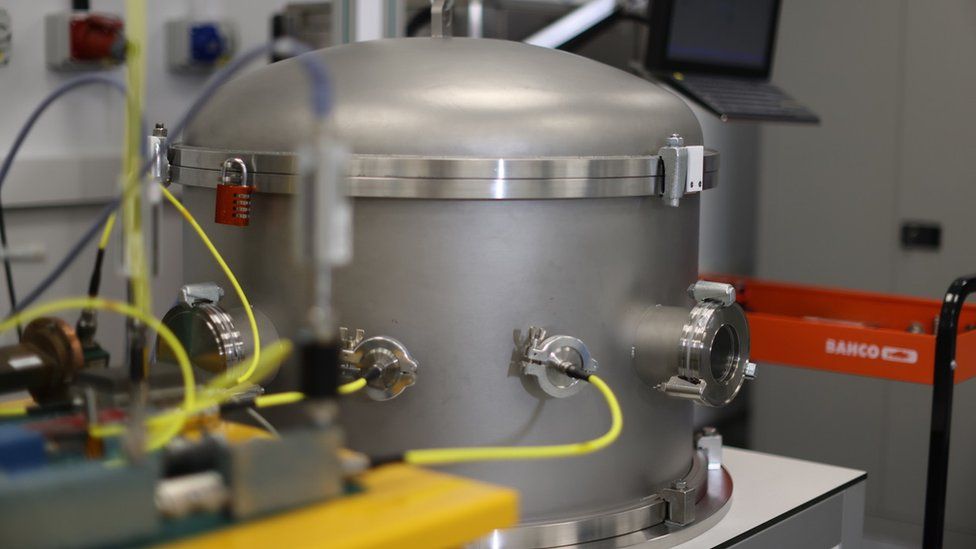 A thermal vacuum which looks like a giant soup pot is used to replicate the conditions of deep space