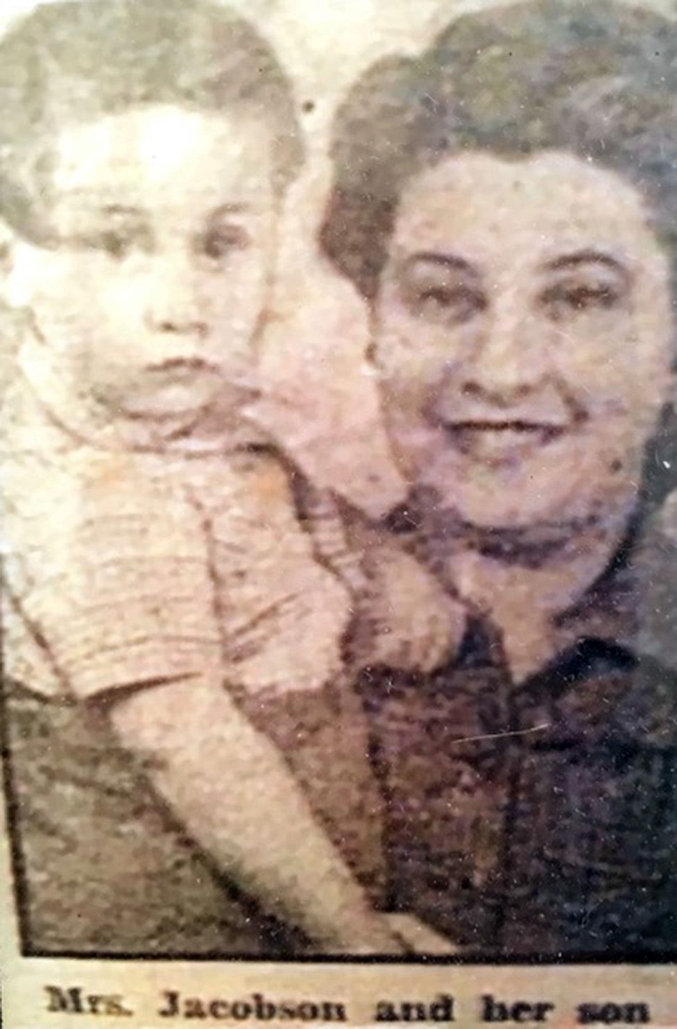 A young Harold Jacobson in his mother's arms