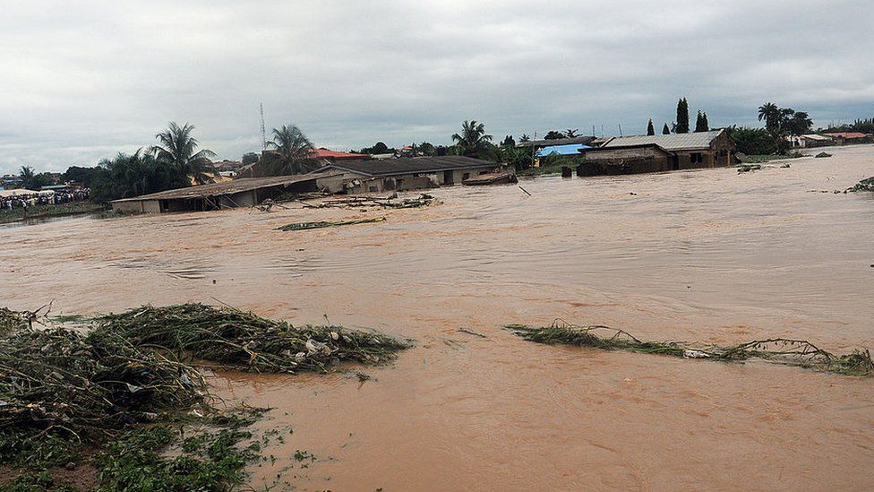 This picture taken on August 27, 2011 shows floodwaters coursing through Ibadan, Odo Ona, in Oyo State.