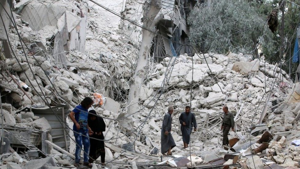 Aftermath of air strike on rebel-held Tariq al-Bab neighbourhood of Aleppo, 23 September