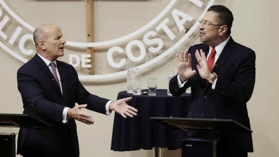 Costa Rican presidential candidate for the National Liberation Party (PLN) and former president of Costa Rica Jose Maria Figueres (L), and presidential candidate for the Social Democratic Progress Party Rodrigo Chaves Robles (R) attend a presidential debate in San Jose, Costa Rica, 23 March 2022.