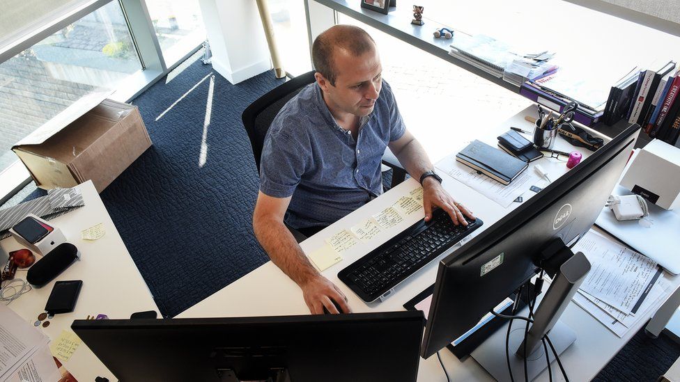 Ron Ashtiani at work at his computer