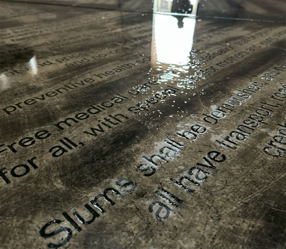 Ntokozo Dube reflected in the Freedom Charter monument in Kliptown, South Africa - 2024