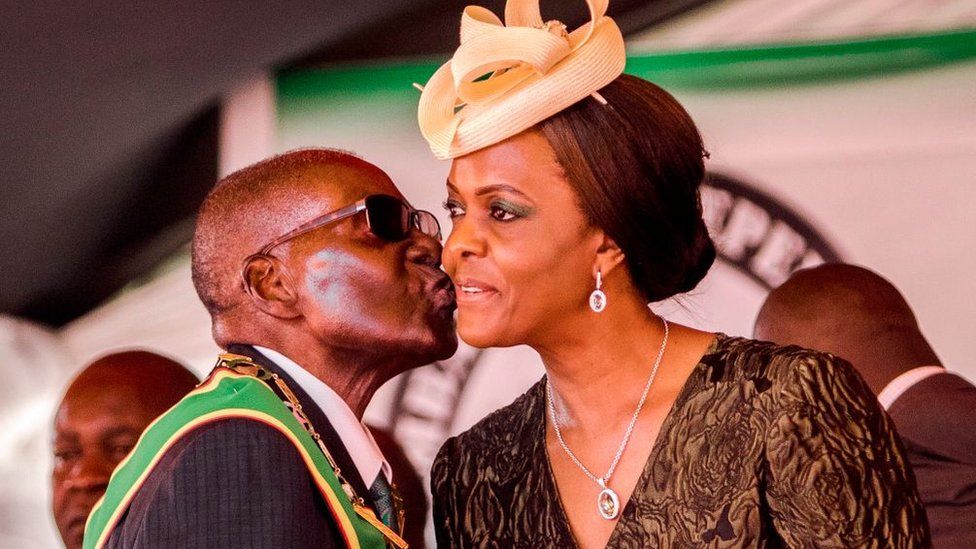 President Robert Mugabe kisses his wife and first lady Grace Mugabe during during the country's 37th Independence Day celebrations at the National Sports Stadium in Harare April 18, 2017.