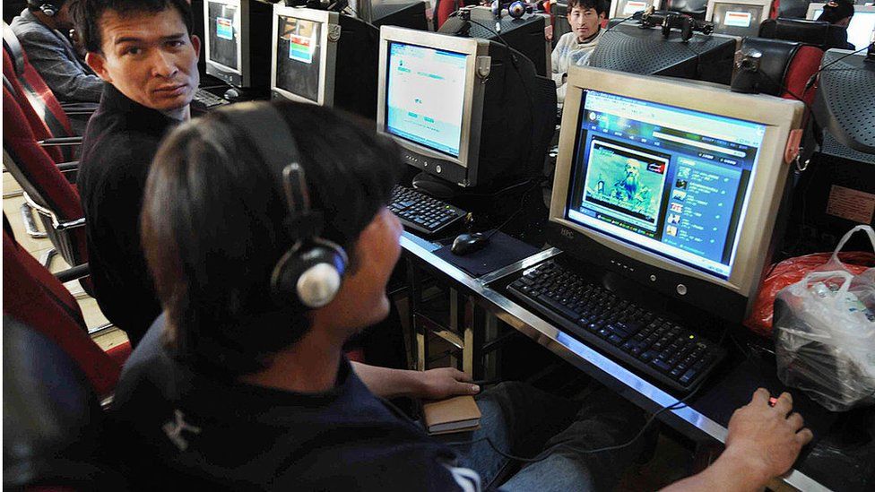 Chinese Muslim Uighurs at an internet cafe in the city of Urumqi in western Xinjiang