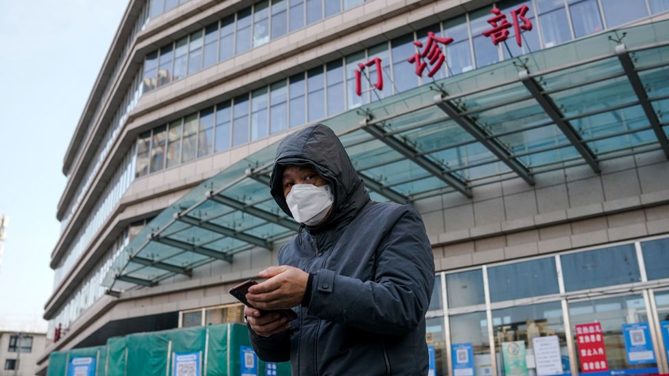A man wearing a face mask outside a hospital in Beijing