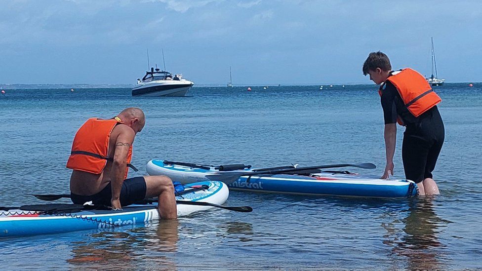 Dorset paddleboarder describes seven hours lost at sea - BBC News