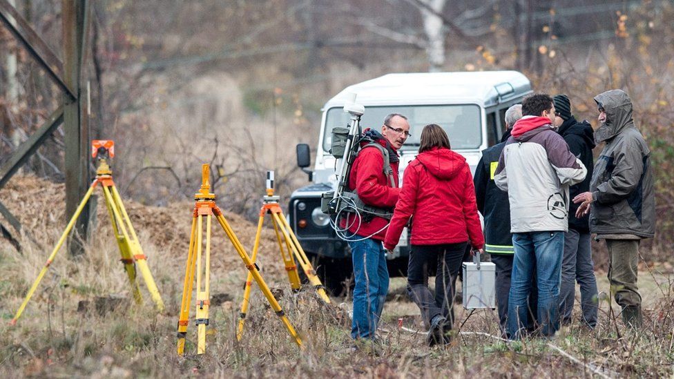 Specialists examine the area near a railway track where an armoured train was allegedly discovered near Walbrzych. 14 Nov 2015