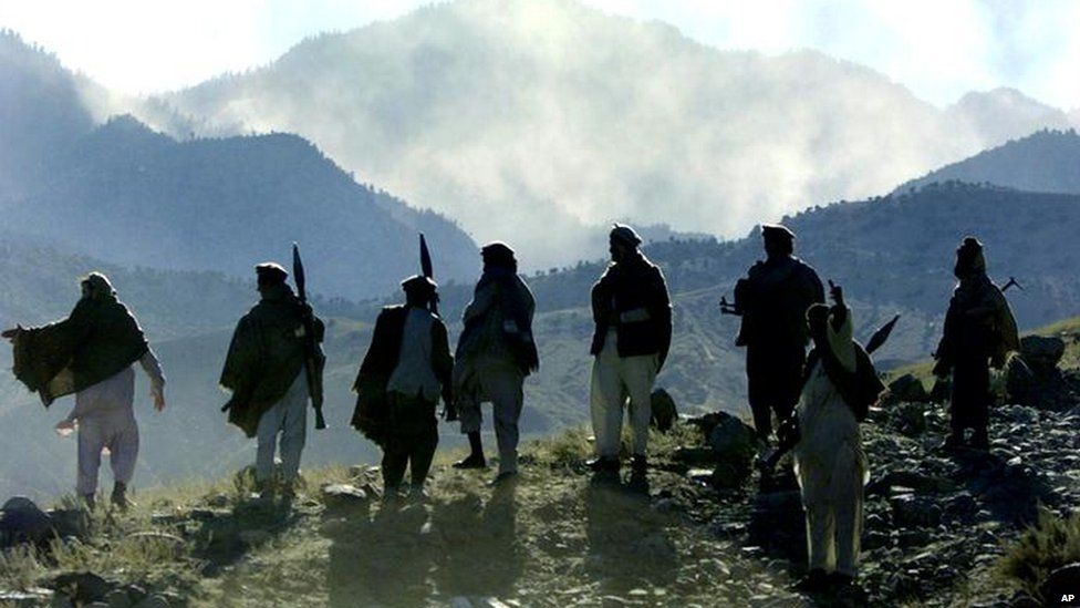 Mujahideen fighters pictured on an Afghan mountain in 2001