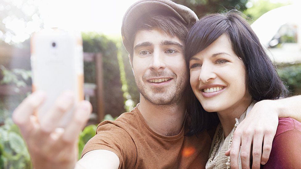 Man and woman with phone