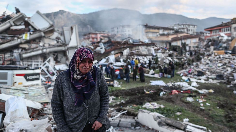 People search for survivors in the rubble of collapsed building in Hatay, Turkey
