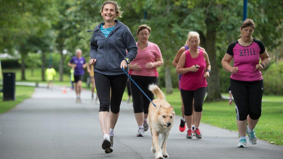 Parkrunners with dog