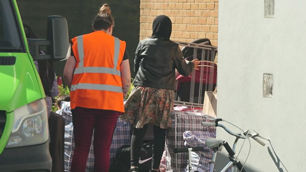 Afghan refugees leave a hotel in Chelmsford