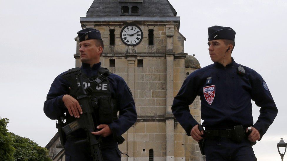 French CRS police outside stricken church near Rouen, 27 Jul 16