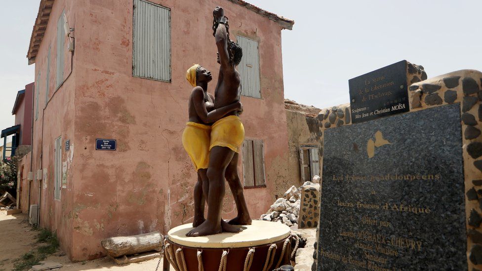A statue commemorating the abolition of slavery stands in front of the House of Slaves museum, before being relocated to the "Freedom and Human Dignity" Square, on Goree island, off the coast of Dakar, Senegal July 3, 2020