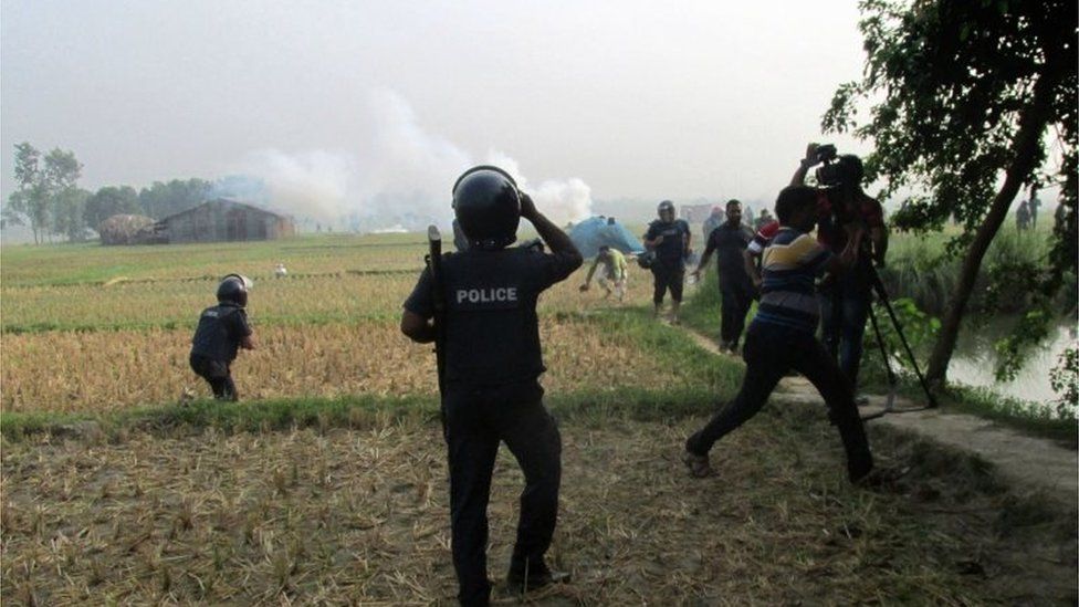 Bangladeshi police officials take part in a raid in Rajshahi on May 11, 2017.
